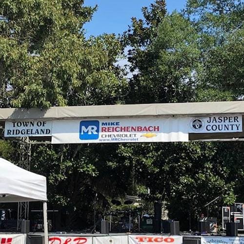 Festival entrance with a banner reading Funland and Hampton County.