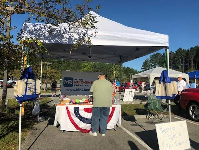 Close-up front view of a bright red vintage Chevrolet pickup truck